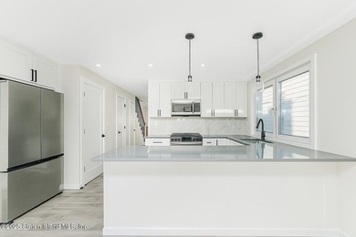 'This elegant 2 Family home features a sophisticated stocco and - photo 16