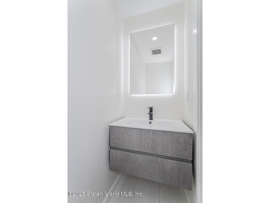 'This elegant 2 Family home features a sophisticated stocco and - photo 18