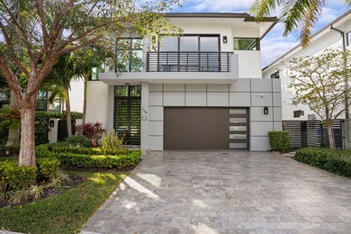Situated on a premium lot in East Delray's La Hacienda, this - photo 1