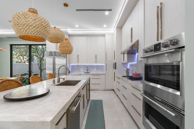 Situated on a premium lot in East Delray's La Hacienda, this - photo 10