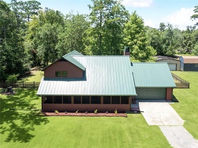 Nestled on 1.48 picturesque acres in the heart of Lacombe, this - photo 1