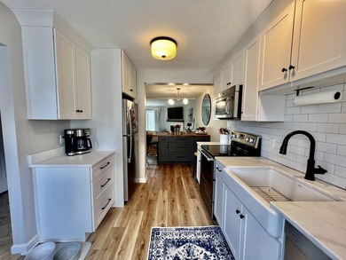 Enjoy serene pond views from this sunny and beautifully updated - photo 3