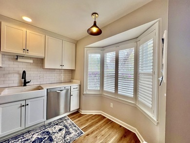 Enjoy serene pond views from this sunny and beautifully updated - photo 5
