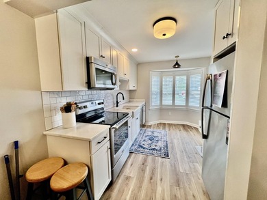 Enjoy serene pond views from this sunny and beautifully updated - photo 6