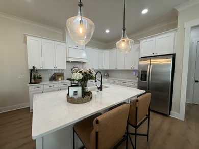 Construction complete and move-in ready! This home is less than - photo 12