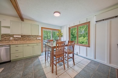 Nestled on over two acres in peaceful Grass Lake, this - photo 13