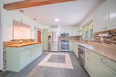 Nestled on over two acres in peaceful Grass Lake, this - photo 17