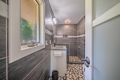 Nestled on over two acres in peaceful Grass Lake, this - photo 25