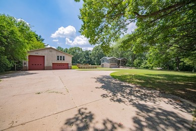 Nestled on over two acres in peaceful Grass Lake, this - photo 47