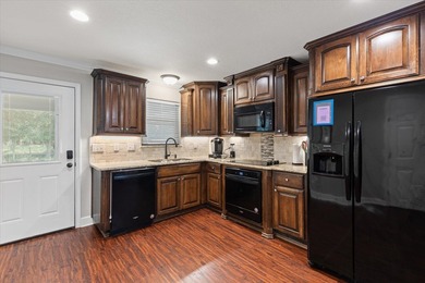 Just a few steps from Lake O' the Pines, this fully furnished - photo 3