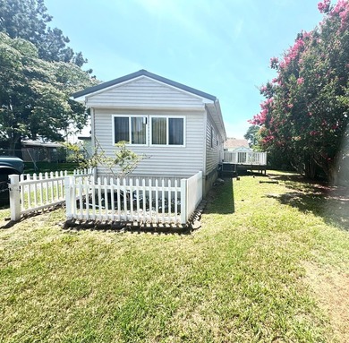 Great Mobile home on OWNED Lot at the end of Serenity Lane. Own