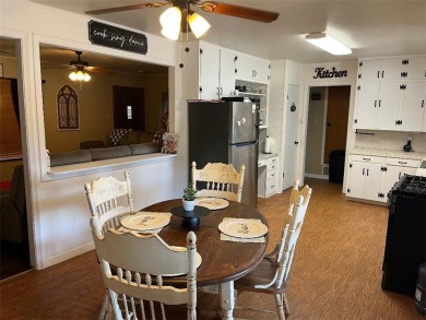 The two-bedroom, one bath home is located on a quiet mature tree