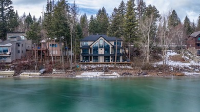 Indulge in exceptional lakefront living with 75 feet of private - photo 2