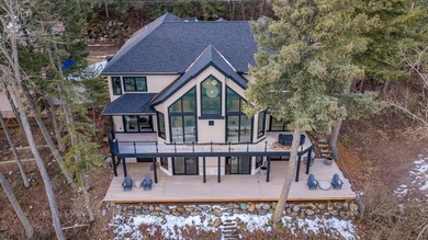 Indulge in exceptional lakefront living with 75 feet of private - photo 3
