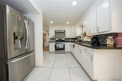 Welcome to this spacious and beautifully updated home nestled on - photo 12