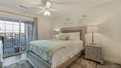 Wake up to peaceful cove views from your screened deck at this - photo 13
