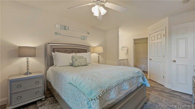Wake up to peaceful cove views from your screened deck at this - photo 14