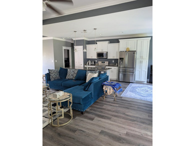 Beautiful open floorplan house with view of pond in backyard - photo 11