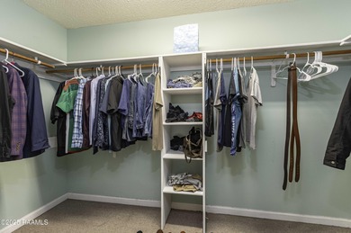 Acadian Style solid metal frame home with metal roof situated on