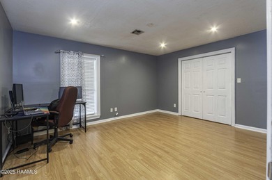 Acadian Style solid metal frame home with metal roof situated on