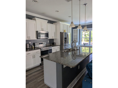 Beautiful open floorplan house with view of pond in backyard - photo 17