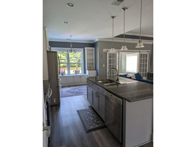 Beautiful open floorplan house with view of pond in backyard - photo 19