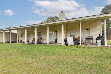 Acadian Style solid metal frame home with metal roof situated on