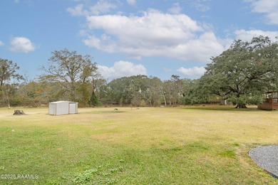 Acadian Style solid metal frame home with metal roof situated on