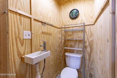 Acadian Style solid metal frame home with metal roof situated on