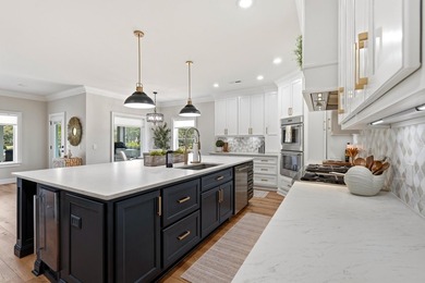 Experience the ultimate waterfront lifestyle in this stunning - photo 11