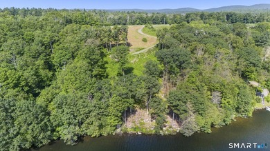 Set along the serene shores of Woodridge Lake, Lot 5 on Milton - photo 3