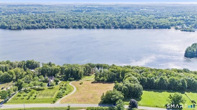 Set along the serene shores of Woodridge Lake, Lot 5 on Milton - photo 4
