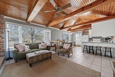 Tucked along the water's edge, this charming rustic cottage is - photo 11