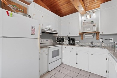 Tucked along the water's edge, this charming rustic cottage is - photo 15