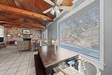 Tucked along the water's edge, this charming rustic cottage is - photo 17