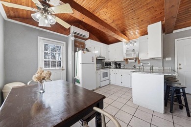 Tucked along the water's edge, this charming rustic cottage is - photo 19
