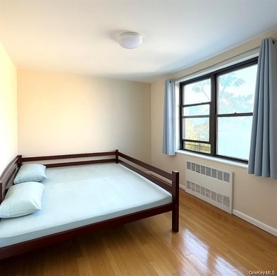 This sun-filled residence features a private balcony and windows - photo 9