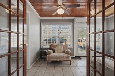 Tucked along the water's edge, this charming rustic cottage is - photo 29