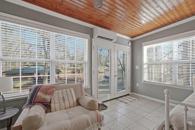 Tucked along the water's edge, this charming rustic cottage is - photo 30