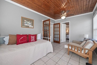 Tucked along the water's edge, this charming rustic cottage is - photo 31