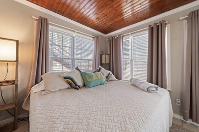 Tucked along the water's edge, this charming rustic cottage is - photo 33