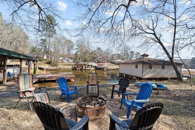 Tucked along the water's edge, this charming rustic cottage is - photo 36