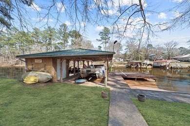 Tucked along the water's edge, this charming rustic cottage is - photo 41