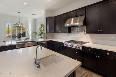 Set on an elevated, private flag lot in the coveted N Scottsdale