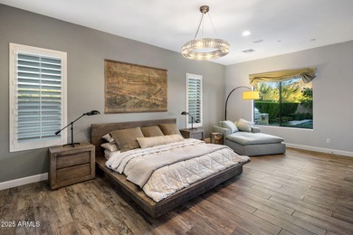 Set on an elevated, private flag lot in the coveted N Scottsdale