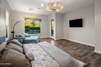 Set on an elevated, private flag lot in the coveted N Scottsdale