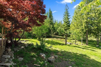 Tucked into the hillside just 26 minutes from Sandpoint, this - photo 6