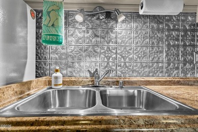 Step into coastal living at its finest with this inviting first