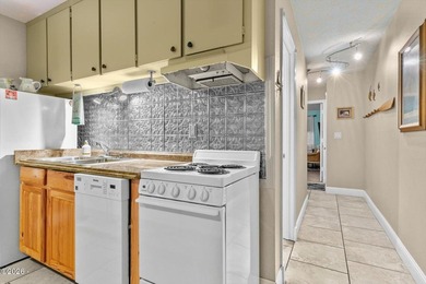 Step into coastal living at its finest with this inviting first