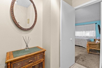 Step into coastal living at its finest with this inviting first